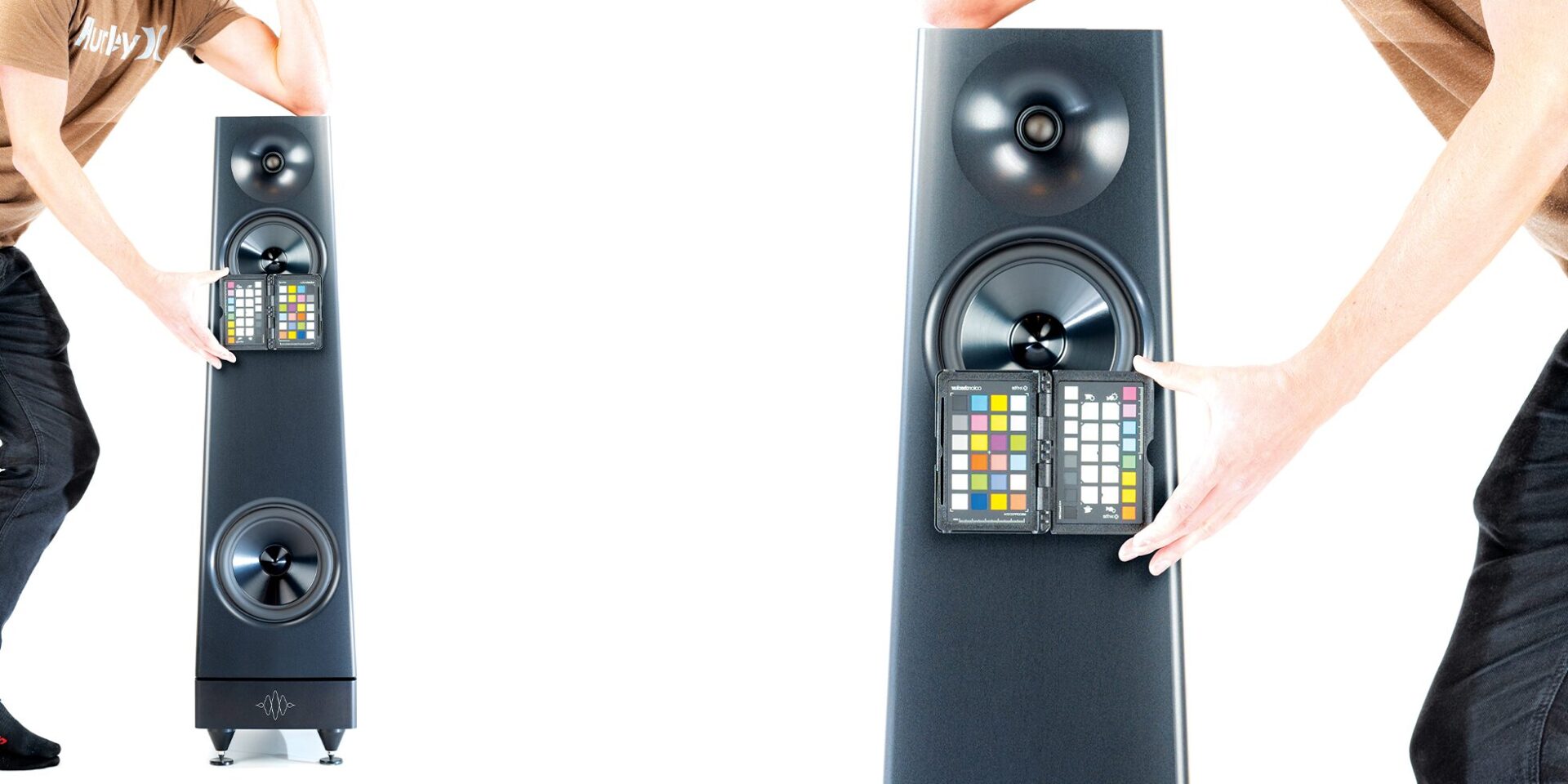 YG Acoustics Peak Ascent Hifi Loudspeakers with someone holding a color palette in front of it