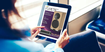 Cropped image of woman holding digital tablet with mock up screen reading online book in public transport, female's finger tapping on portable computer checking feeds in social networks via wifi